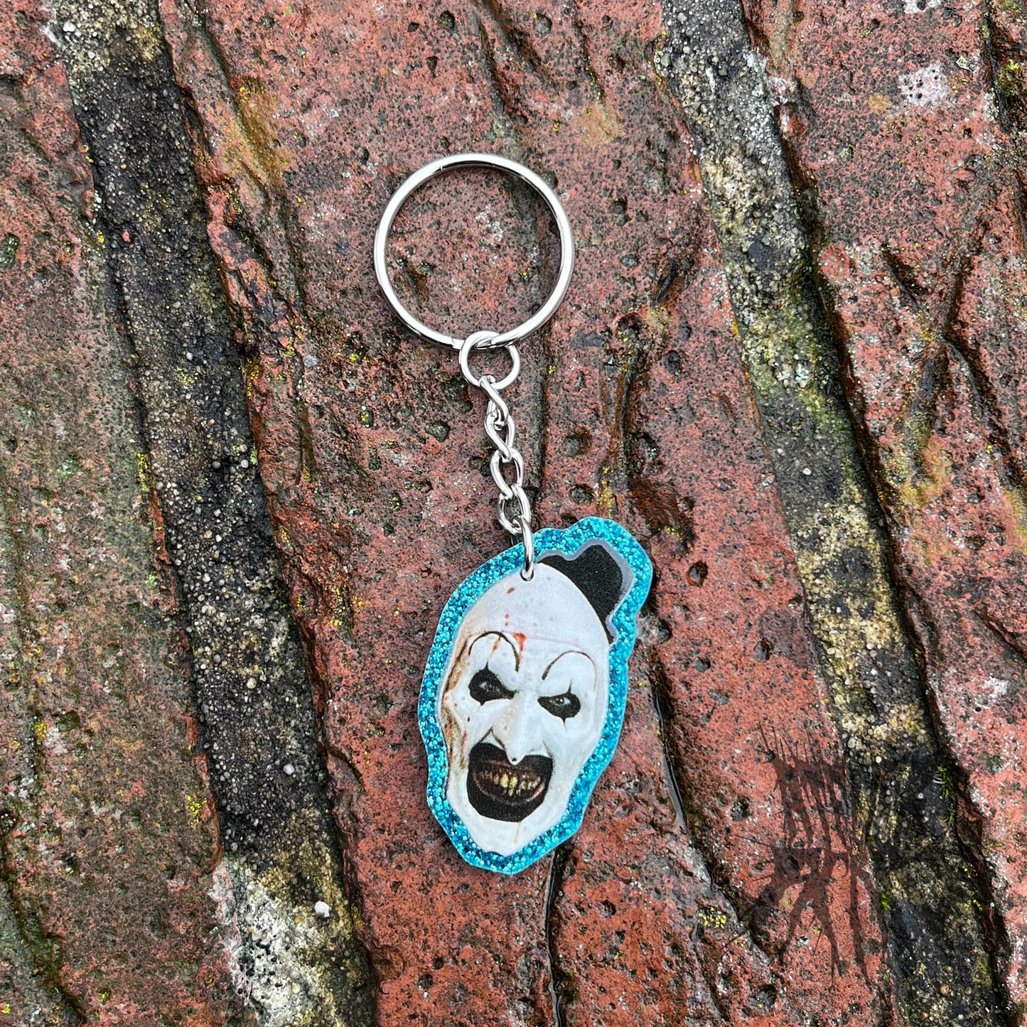 The Terrifier Glitter Keyring - Horror movie Keyring. Art the Clown Keyring