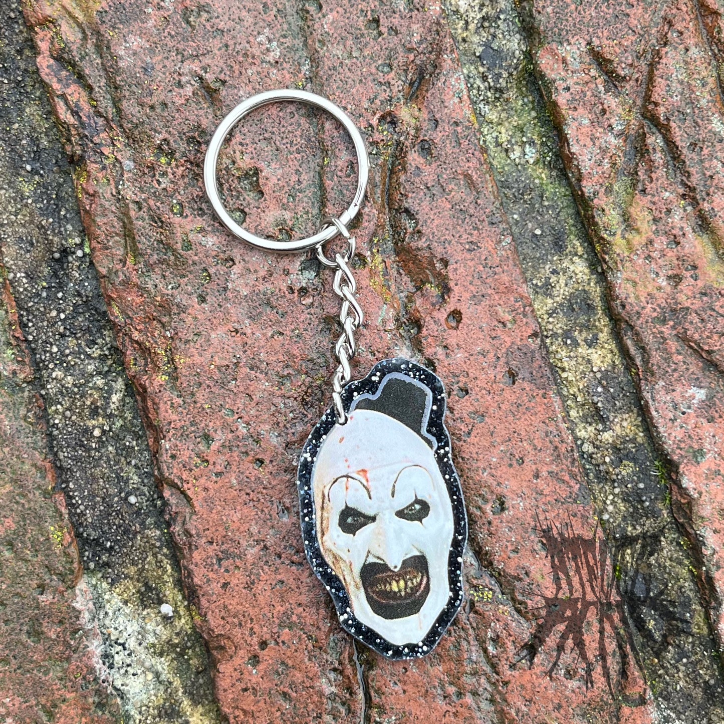 The Terrifier Glitter Keyring - Horror movie Keyring. Art the Clown Keyring