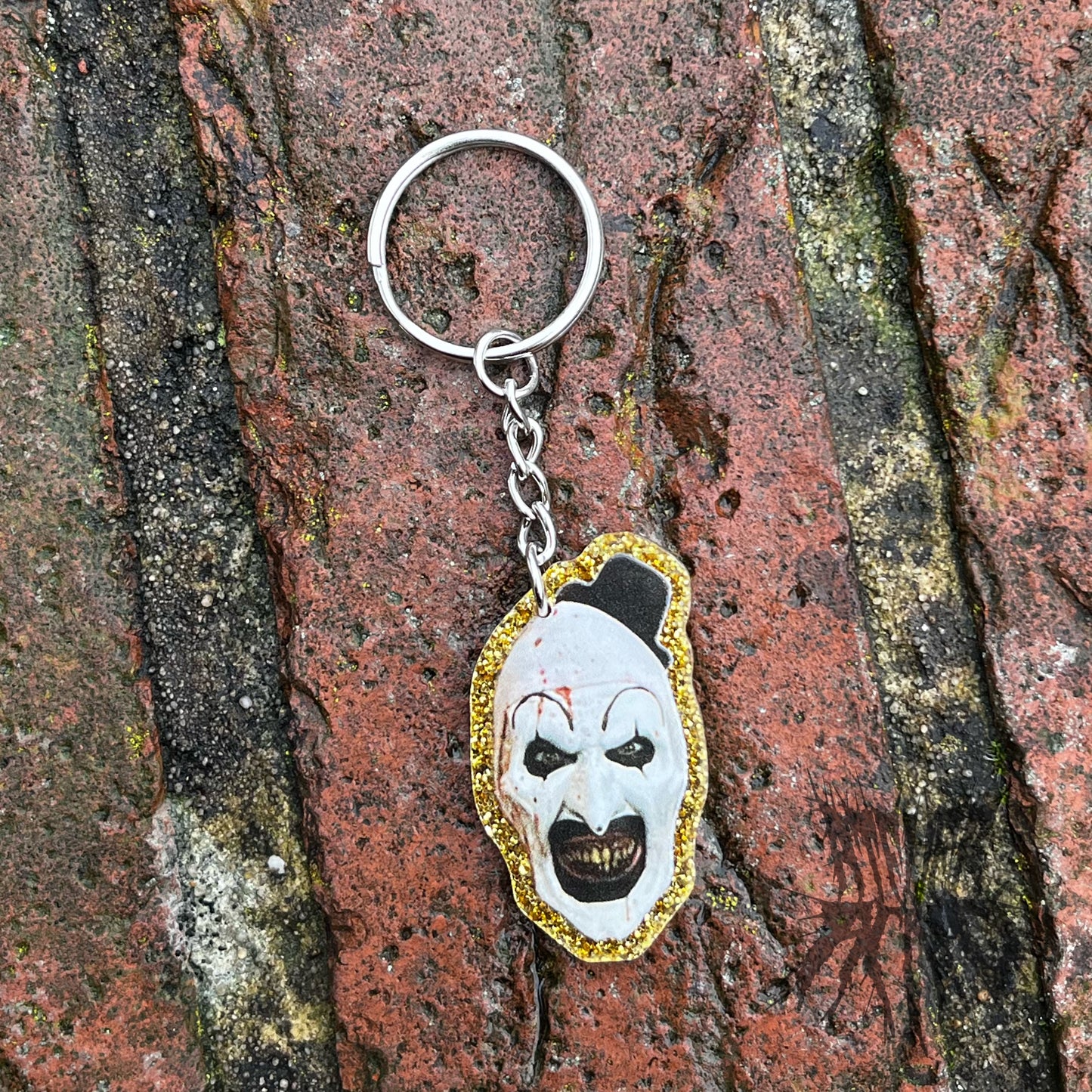 The Terrifier Glitter Keyring - Horror movie Keyring. Art the Clown Keyring