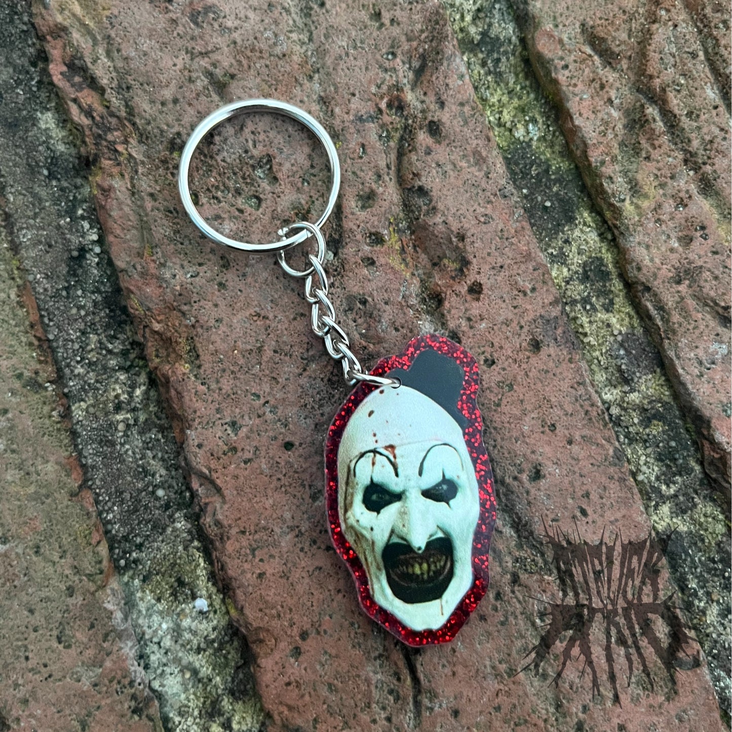 The Terrifier Glitter Keyring - Horror movie Keyring. Art the Clown Keyring